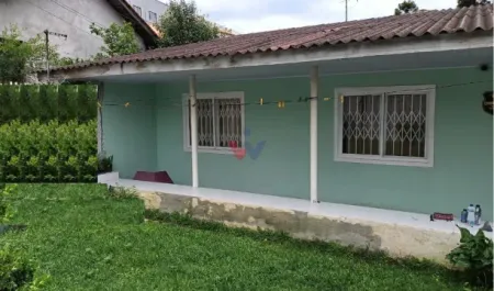 Oportunidade Única Terreno com Casa Principal e 4 Casas nos Fundos para Renda Extra
