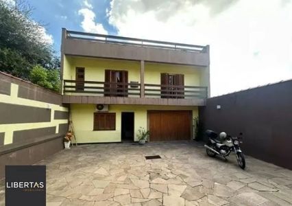 Ótima casa no bairro Jardim Lindóia, com 4 quartos, pátio amplo e área com churrasquira